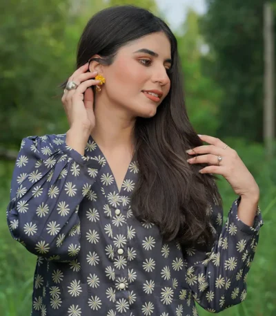 girl wearing a black printed casual shirt with smiling face in style