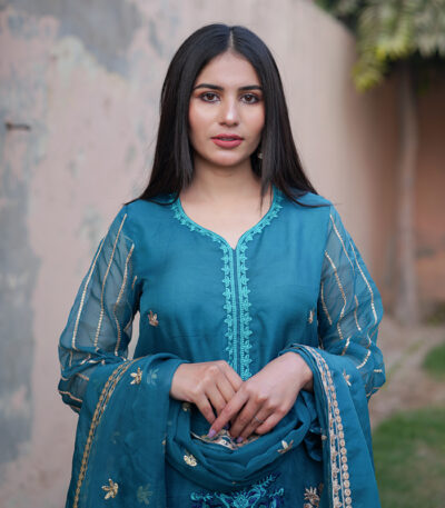 Shop with Namra is offering tea blue Pakistani formal organza dress in latest festive collection 2024